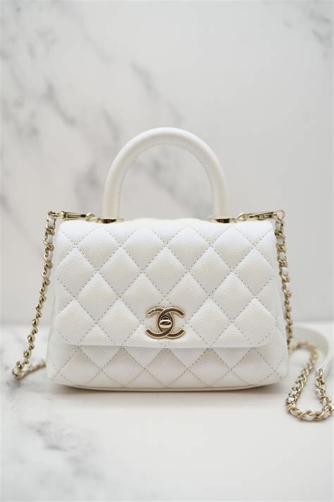 white iridescent chanel coco handle.